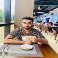 Elegant man enjoying meal at a restaurant, modern dining experience, Rahian Hussain.